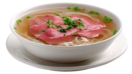 Delicious bowl of beef pho with fresh herbs and rice noodles served in white dish on a wooden table