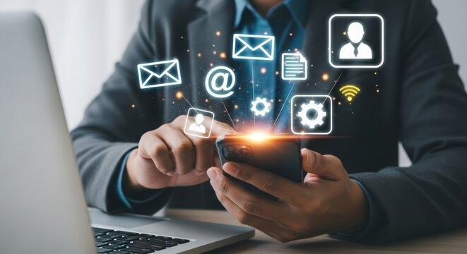 Man using smartphone with digital icons, symbolizing communication, technology, and online business