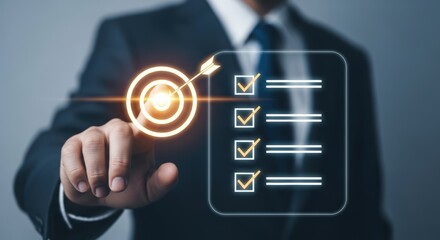 Businessman touching screen with target and completed checklist, symbolizing goal achievement © PFU