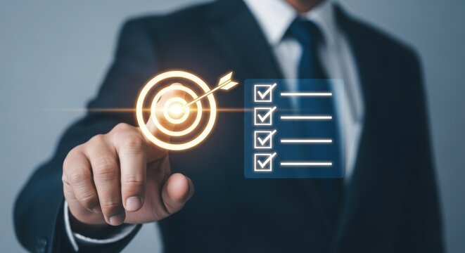 Businessman pointing at a glowing target with an arrow hitting the bullseye, representing business goals and success