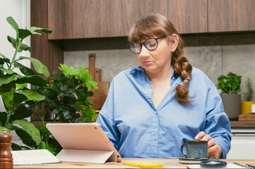 Elderly woman professor, teacher, tutor or psychologist conducts online consultation or training on...