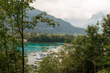 View of Lake Walen, Switzerland, Swiss Alps, Canton St. Gallen, Chatzenberg, summer 2025. Trees,...