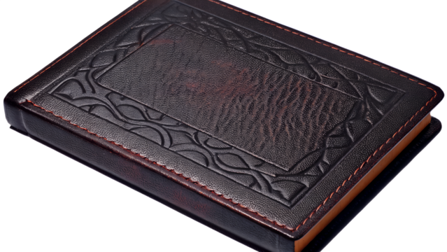 Closeup of an antique leatherbound book with an ornate embossed pattern on the cover, isolated on transparent background
