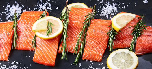 Fresh fish. Raw salmon on black background