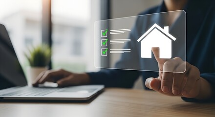 Person interacting with a holographic house and data on a digital interface