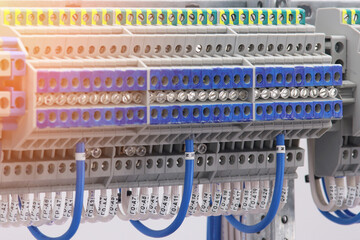 Electrical screw terminals for connecting wires in an electrical switchboard. Soft focus. Close-up.