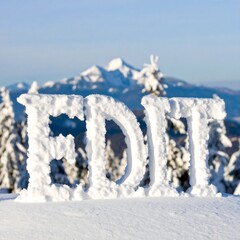 Snow-covered letters on a mountaintop