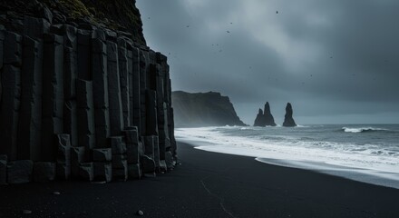 Volcanic sand at Reynisfjara Beach, Vik, Iceland with basalt columns