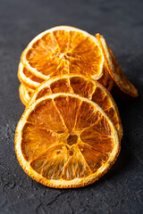 Dried orange slices on black  background.