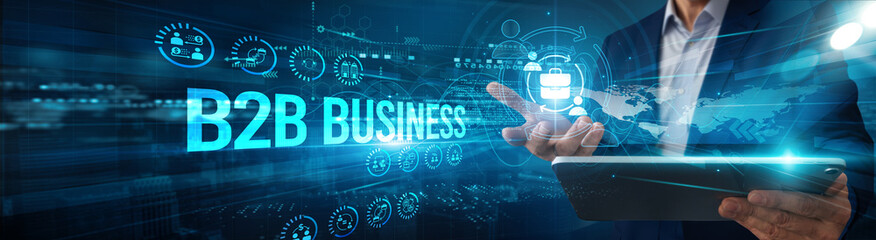 A business executive using a tablet analyzing B2B business network data collaboration, partnership...
