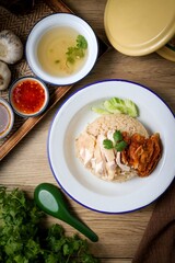 Mixed Chicken and rice ,boied chicken with fried chicken and rice,coriander and cucumber with sauce and soup , hainanese chicken rice, thai called khao man gai,