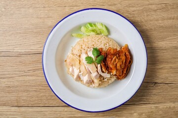 Mixed Chicken and rice ,boied chicken with fried chicken and rice,coriander and cucumber with sauce and soup , hainanese chicken rice, thai called khao man gai,
