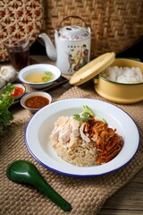 Mixed Chicken and rice ,boied chicken with fried chicken and rice,coriander and cucumber with sauce and soup , hainanese chicken rice, thai called khao man gai,