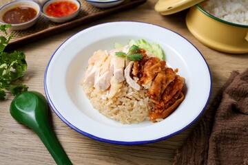Mixed Chicken and rice ,boied chicken with fried chicken and rice,coriander and cucumber with sauce and soup , hainanese chicken rice, thai called khao man gai,