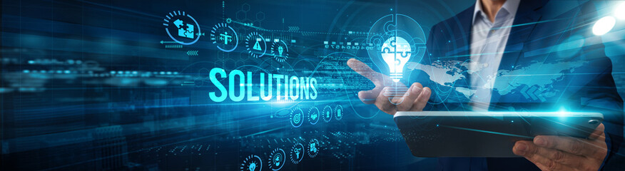 A consultant using a tablet is analyzing solutions design data implementation, monitoring...