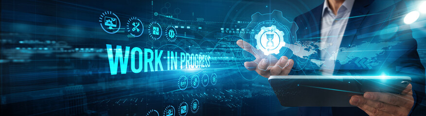 The supervisor is using a tablet to analyze work-in-progress project data milestones and monitor efficiency tracking integration optimization innovation performance.