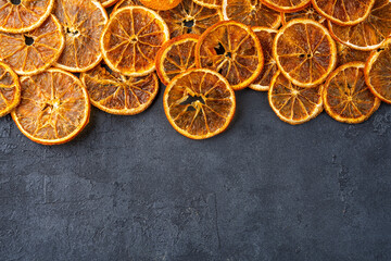 Dried orange slices on black  background.