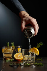 Cocktail Gin and Tonic with lemon and rosemary.