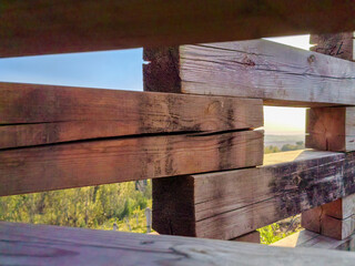 Wooden Fence Framing a Scenic Landscape at Sunset