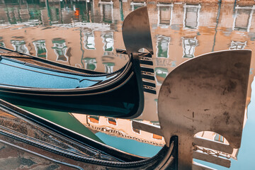 Traditional Venetian gondolas with ornate seats in Venice, Italy