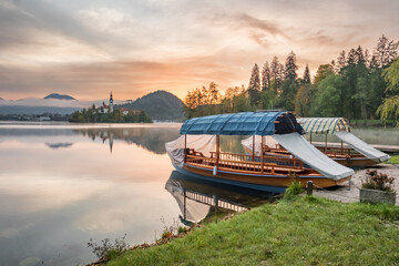 Lake Bled in autumn with island church and Bled Castle in Slovenia