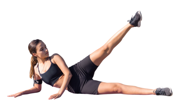 A young slim athletic girl in sportswear with snakeskin prints performs a set of exercises. Fitness and healthy lifestyle.