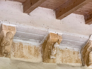 Eroded corbel above Romanesque arch in San Nicolas de Bari Church Sotillo de Boedo Palencia