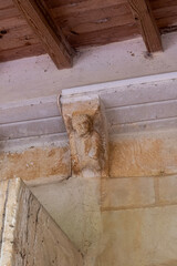 Eroded corbel above Romanesque arch in San Nicolas de Bari Church Sotillo de Boedo Palencia © Agustin