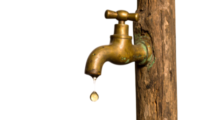 Old rustic water tap with water drop isolated on solid white background Png form