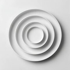 Obraz premium Minimalist white plates arrangement showcases a clean and elegant aesthetic, perfect for culinary presentations and modern dining.