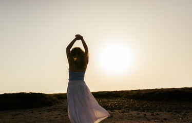 Embracing freedom at sunset