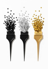 Three hair dye brushes with black silver and gold glitter sprinkles