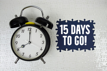 15 Days To Go! text with alarm clock on navy blue background