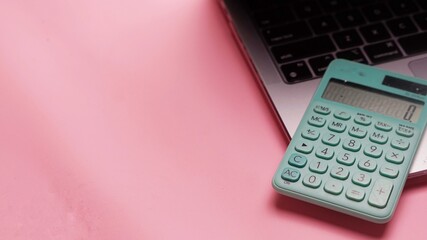 calculator on pink background