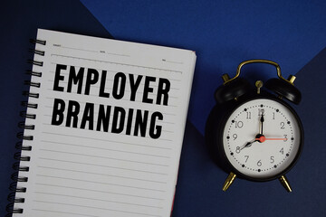 Employer Branding text written on notepad with calculator and on navy blue background