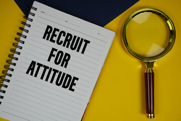 Recruit For Attitude text with magnifying glass on yellow background