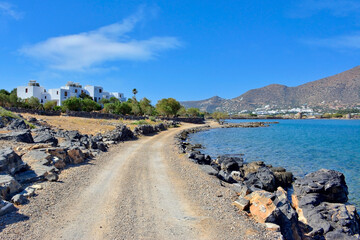 Dirt road of the  sea coast of the island Crete, Elounda town, Greece