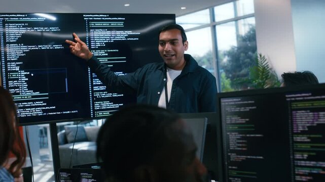 Indian Software Developer Manager Leader presenting Coding Software development application Project, Briefing solution to Programmer Team in Co working Office Space. Tech and artificial intelligence.