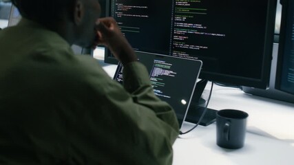 Professional Black Software developer and Computer Programmer Typing on keyboard and Using Desktop computer, writing code, Development Software Application, Cyber Security Programming in tech Office. - Powered by Adobe