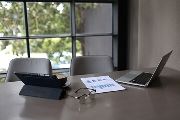 An overflowing office desk with scattered paperwork and documents, symbolizing business planning,...