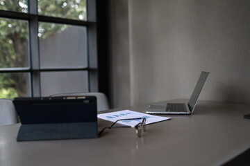 An overflowing office desk with scattered paperwork and documents, symbolizing business planning,...