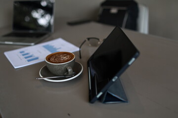 An overflowing office desk with scattered paperwork and documents, symbolizing business planning,...