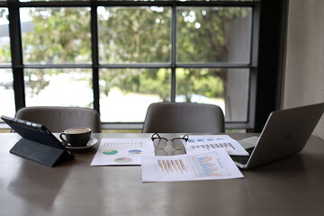 An overflowing office desk with scattered paperwork and documents, symbolizing business planning,...