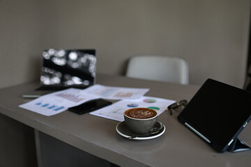 An overflowing office desk with scattered paperwork and documents, symbolizing business planning,...