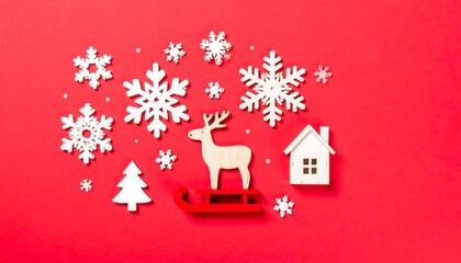 Festive winter decorations arranged on a red background.