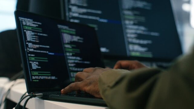Close up of Software developer, Computer Programmer Hand typing Laptop computer keyboard, write code in Modern Office workplace. Hand of Male IT Professional working on Coding, Ai prompt Project.