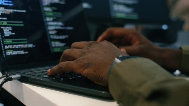 Close up of Software developer, Computer Programmer Hand typing Laptop computer keyboard, write code in Modern Office workplace. Hand of Male IT Professional working on Coding, Ai prompt Project.