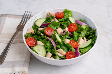 salad  top with chicken , lettuce and tomatoes