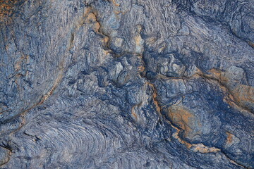 Abstract, natural background. Texture and pattern on the weathered surface of a rock.