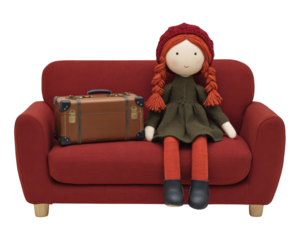 Doll with red hair and red hat sitting on red sofa beside vintage suitcase, cozy and cheerful atmosphere, travel concept, childhood memory, home interior